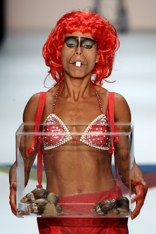 Illustration for article titled Scary Card-Playing Clowns, Lady Gaga Monsters, And Saran-Wrap Savages: Has Fashion Gone Insane?